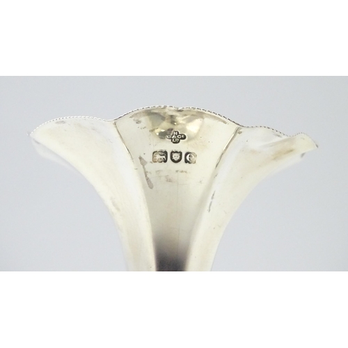 319 - A silver bud vase with flared rim hallmarked London 1900, maker Horace Woodward & Co Ltd. Approx. 4 ... 