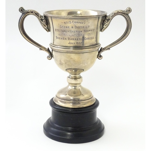 322 - A twin handled pedestal trophy cup on socle stand. The cup engraved No 15 Company Stone & District G... 