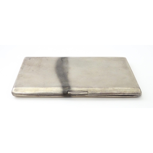 333 - An Art Deco silver cigarette case with gilded interior, hallmarked Birmingham 1931, maker Frederick ... 