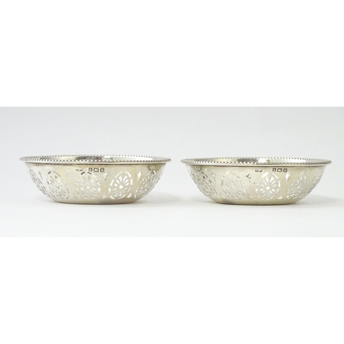 348 - A pair of silver bon bon dishes with pierced decoration, hallmarked Birmingham 1942, maker Levi & Sa... 