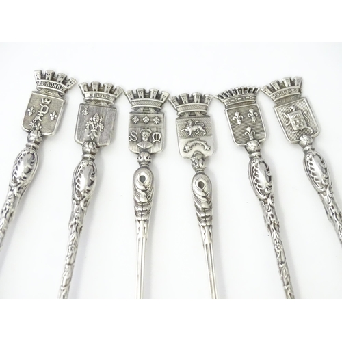 351 - Six French silver souvenir teaspoons, the handles with terminals formed as various town crests, the ... 