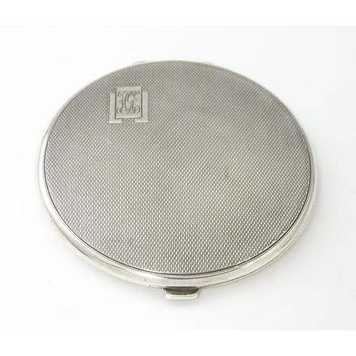 360 - An Art Deco silver compact of engine turned decoration hallmarked Birmingham 1939, maker William Suc... 