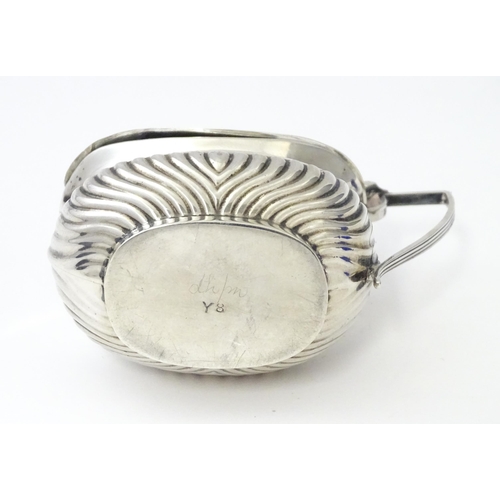 367 - A silver mustard pot with fluted decoration hallmarked Birmingham 1906, maker Robert Pringle & Sons.... 