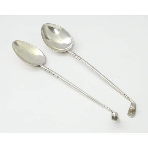 369 - Two silver coffee spoons, the handles formed as golf clubs and balls, hallmarked Birmingham 1933, ma... 