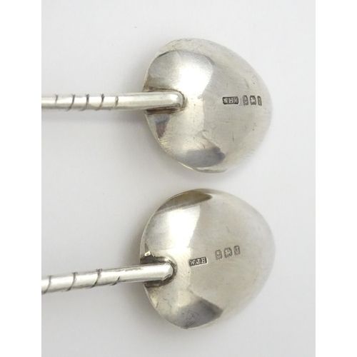 369 - Two silver coffee spoons, the handles formed as golf clubs and balls, hallmarked Birmingham 1933, ma... 