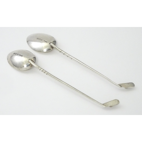 369 - Two silver coffee spoons, the handles formed as golf clubs and balls, hallmarked Birmingham 1933, ma... 