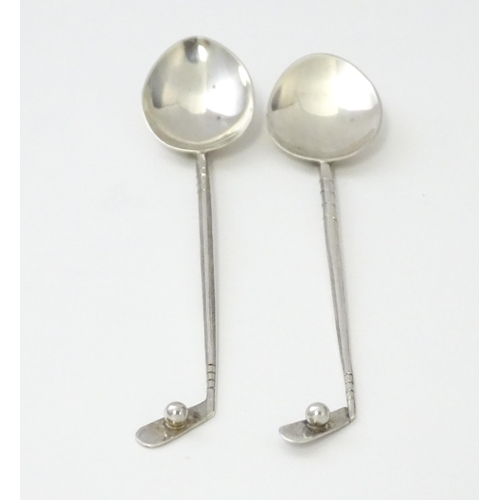 369 - Two silver coffee spoons, the handles formed as golf clubs and balls, hallmarked Birmingham 1933, ma... 