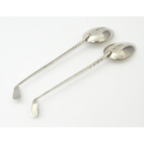 369 - Two silver coffee spoons, the handles formed as golf clubs and balls, hallmarked Birmingham 1933, ma... 