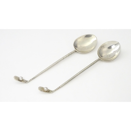 369 - Two silver coffee spoons, the handles formed as golf clubs and balls, hallmarked Birmingham 1933, ma... 