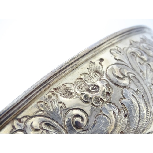 448 - A Victorian silver large pedestal bowl / rose bowl with embossed floral and acanthus scroll detail, ... 