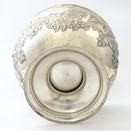 448 - A Victorian silver large pedestal bowl / rose bowl with embossed floral and acanthus scroll detail, ... 