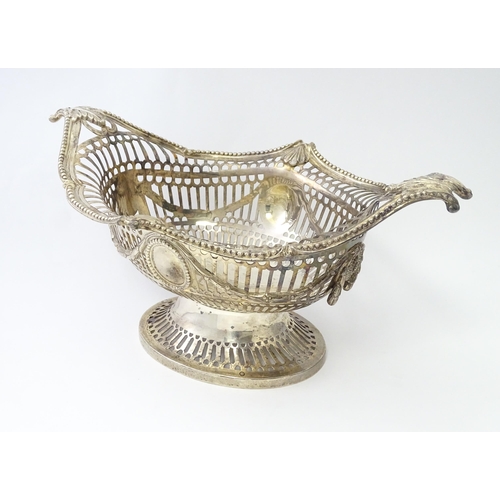 450 - A Victorian silver pedestal dish / basket with pierced decoration and swag and acanthus detail, hall... 