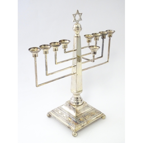 453 - A silver nine branch menorah with swag and bead decoration, hallmarked London 1953, maker A Taite & ... 