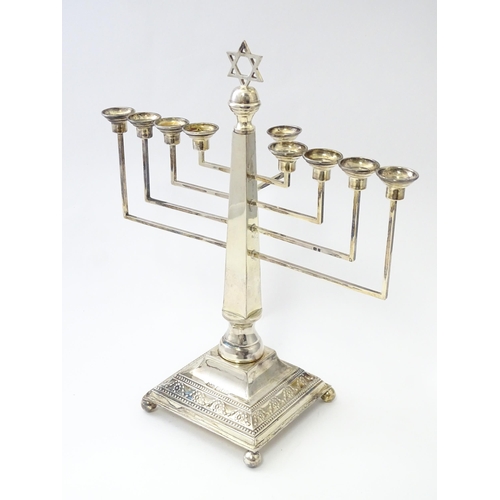 453 - A silver nine branch menorah with swag and bead decoration, hallmarked London 1953, maker A Taite & ... 