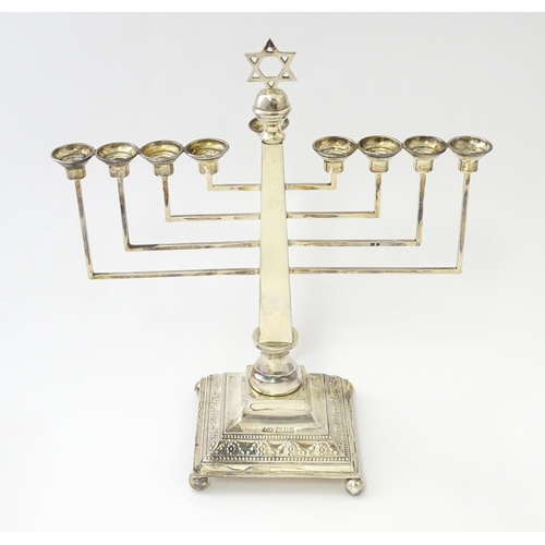 453 - A silver nine branch menorah with swag and bead decoration, hallmarked London 1953, maker A Taite & ... 