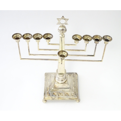 453 - A silver nine branch menorah with swag and bead decoration, hallmarked London 1953, maker A Taite & ... 