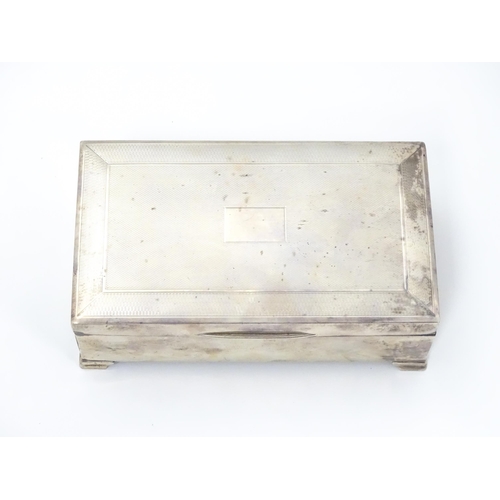 478 - A silver table top cigarette box with engine turned decoration opening to reveal a cedar lined inter... 