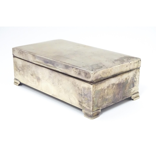 478 - A silver table top cigarette box with engine turned decoration opening to reveal a cedar lined inter... 