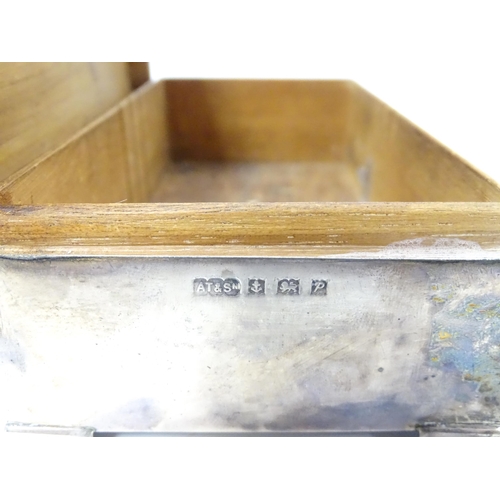 478 - A silver table top cigarette box with engine turned decoration opening to reveal a cedar lined inter... 