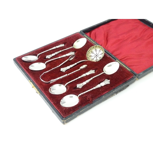 500 - A cased set of six silver teaspoons with tongs and sifter spoon en suite, hallmarked Birmingham 1904... 