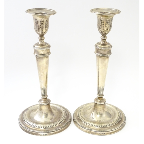 457 - A pair of silver candlesticks hallmarked Sheffield 1971, maker Hawksworth, Eyre & Co Ltd. Approx. 10... 