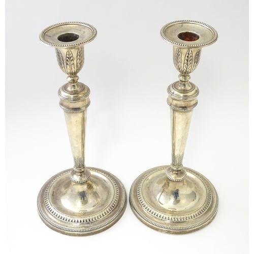 457 - A pair of silver candlesticks hallmarked Sheffield 1971, maker Hawksworth, Eyre & Co Ltd. Approx. 10... 