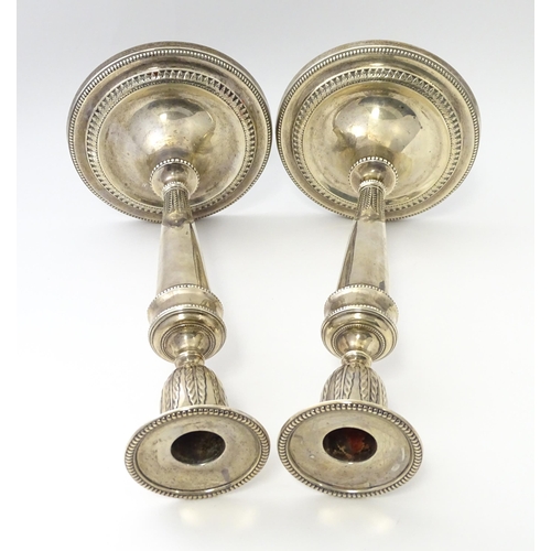 457 - A pair of silver candlesticks hallmarked Sheffield 1971, maker Hawksworth, Eyre & Co Ltd. Approx. 10... 