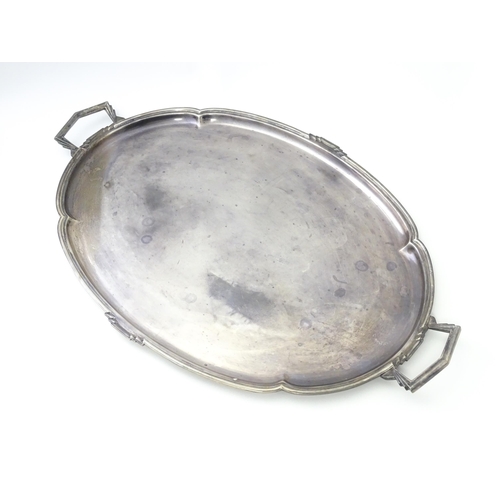 458 - An Art Deco silver twin handle tray of oval form, hallmarked Sheffield 1936, maker Mappin & Webb Ltd... 