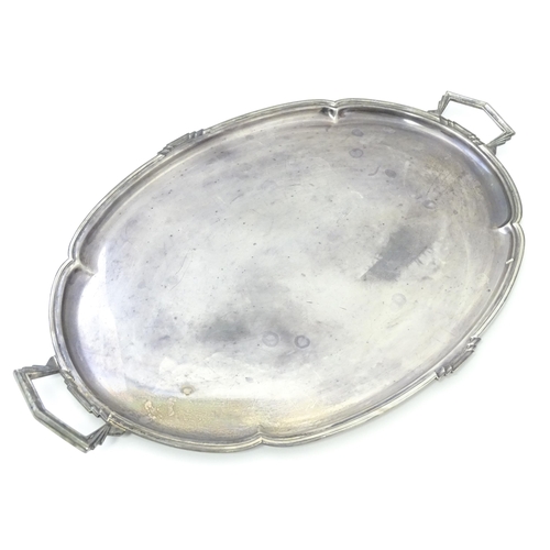 458 - An Art Deco silver twin handle tray of oval form, hallmarked Sheffield 1936, maker Mappin & Webb Ltd... 