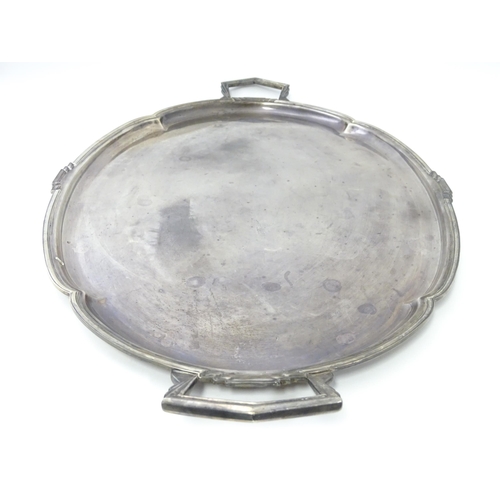 458 - An Art Deco silver twin handle tray of oval form, hallmarked Sheffield 1936, maker Mappin & Webb Ltd... 