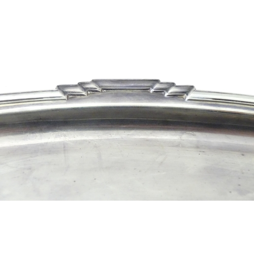 458 - An Art Deco silver twin handle tray of oval form, hallmarked Sheffield 1936, maker Mappin & Webb Ltd... 