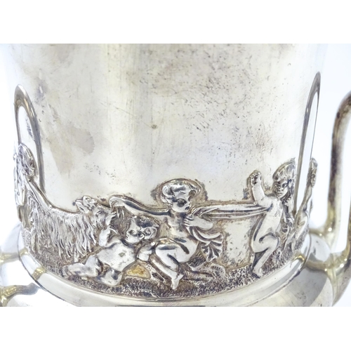 459 - A silver twin handled vase of campana urn form decorated with classical scenes depicting putti with ... 