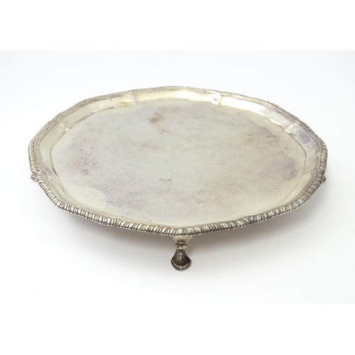 461 - A Victorian silver card tray, standing on four feet, hallmarked London 1897, maker Edward Barnard & ... 