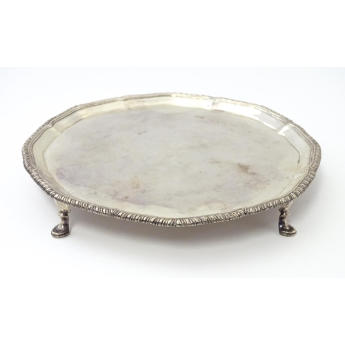 461 - A Victorian silver card tray, standing on four feet, hallmarked London 1897, maker Edward Barnard & ... 