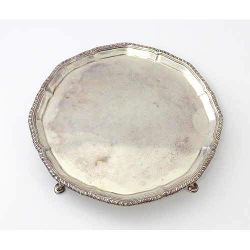 461 - A Victorian silver card tray, standing on four feet, hallmarked London 1897, maker Edward Barnard & ... 