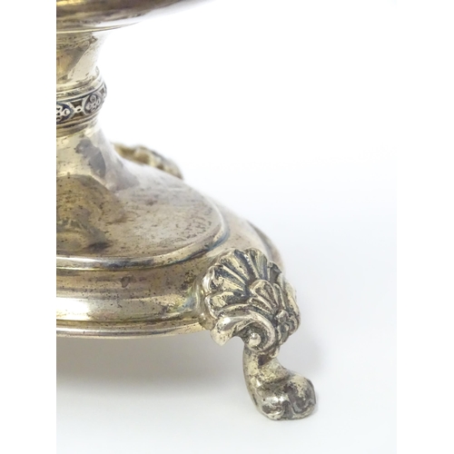 464 - A silver twin handled pedestal bowl with fretwork decoration and figural detail to handles, standing... 