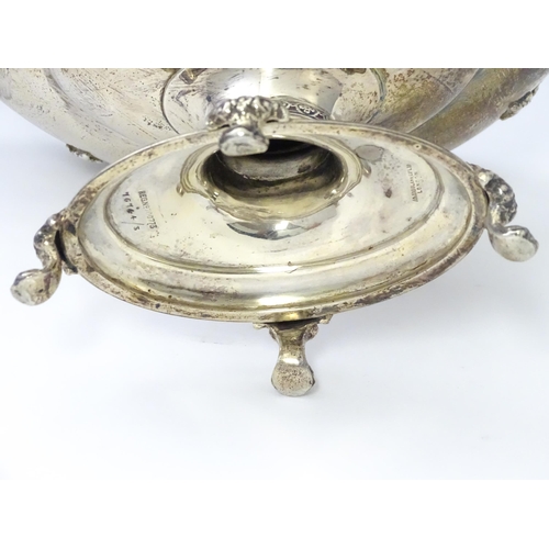 464 - A silver twin handled pedestal bowl with fretwork decoration and figural detail to handles, standing... 