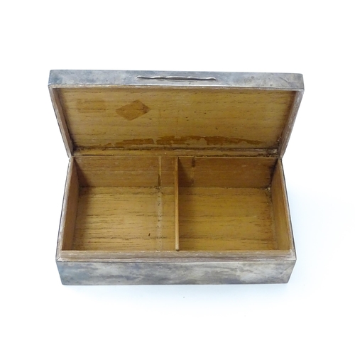 469 - An Art Deco silver table top cigarette box with engine turned decoration opening to reveal a cedar l... 