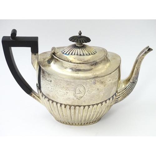 477 - A Victorian silver three piece tea set comprising teapot, cream jug and twin handled sugar bowl with... 