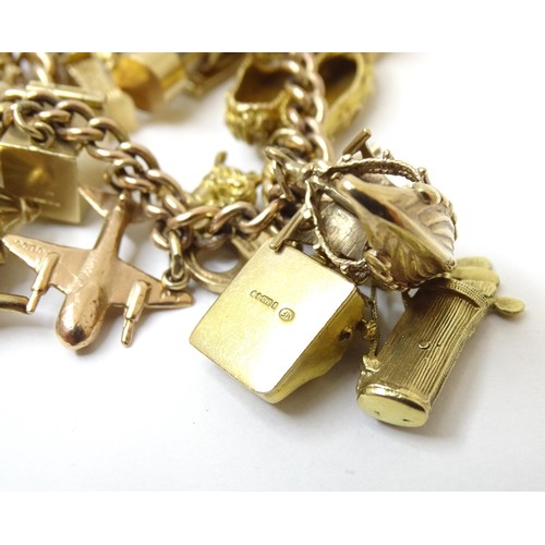 595 - A 9ct gold charm bracelet set with 18 various 9ct gold and some yellow metal charms to include charm... 