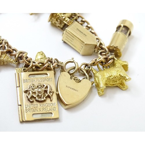 595 - A 9ct gold charm bracelet set with 18 various 9ct gold and some yellow metal charms to include charm... 