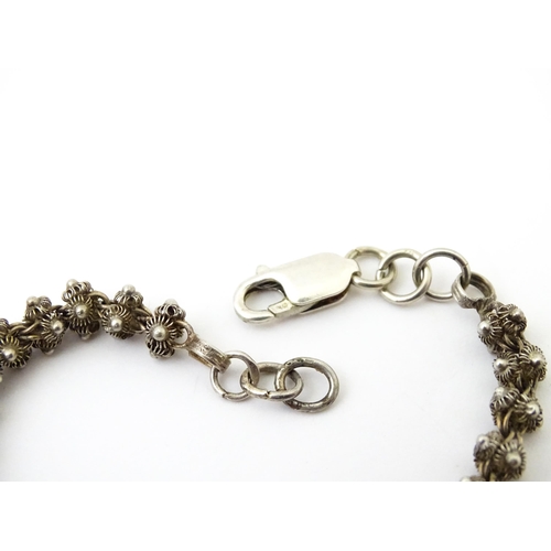 646 - A quantity of assorted jewellery to include silver and white metal bracelets, silver chain necklaces... 