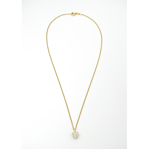 648 - An 18ct gold necklace with heart shaped pendant set with a profusion of diamonds. Approx. 16