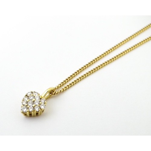 648 - An 18ct gold necklace with heart shaped pendant set with a profusion of diamonds. Approx. 16