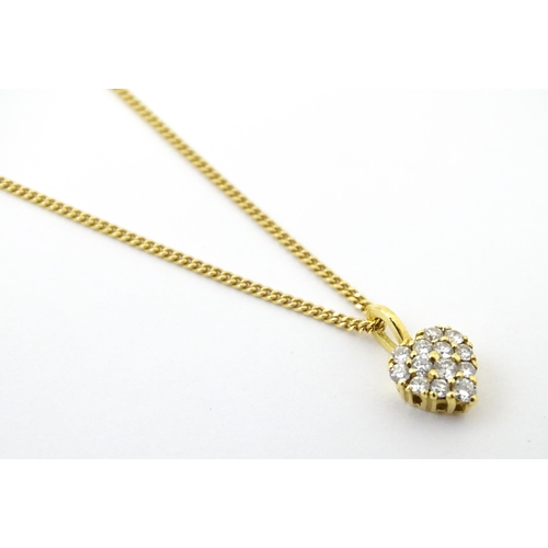 648 - An 18ct gold necklace with heart shaped pendant set with a profusion of diamonds. Approx. 16