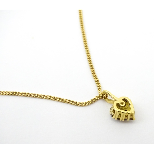 648 - An 18ct gold necklace with heart shaped pendant set with a profusion of diamonds. Approx. 16