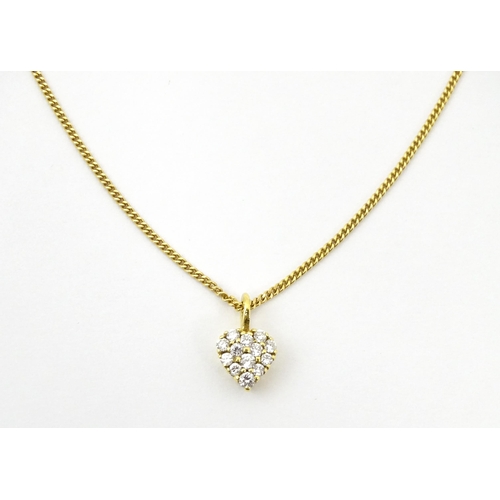 648 - An 18ct gold necklace with heart shaped pendant set with a profusion of diamonds. Approx. 16