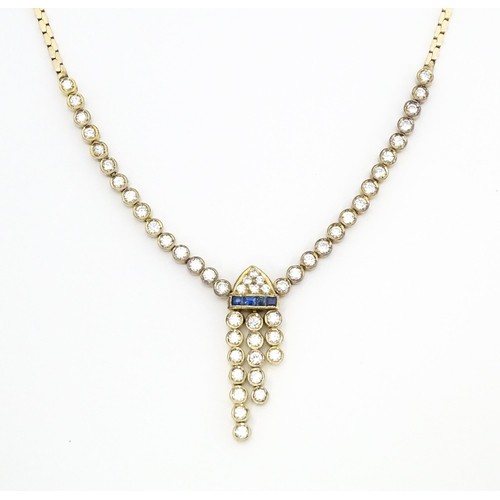 652 - A 14ct gold necklace set with 51 diamonds and a band of 4 sapphires in an Art Deco setting. Approx. ... 