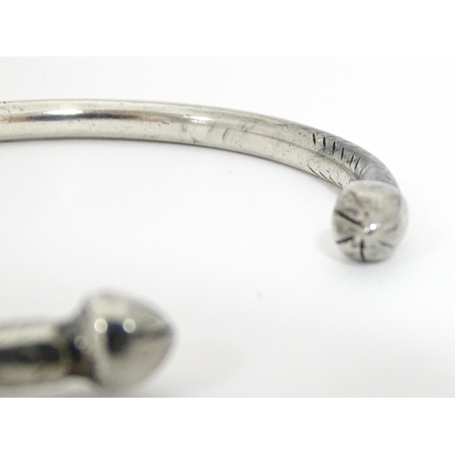 657 - A white metal torque bangle / bracelet