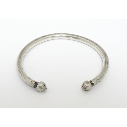 657 - A white metal torque bangle / bracelet